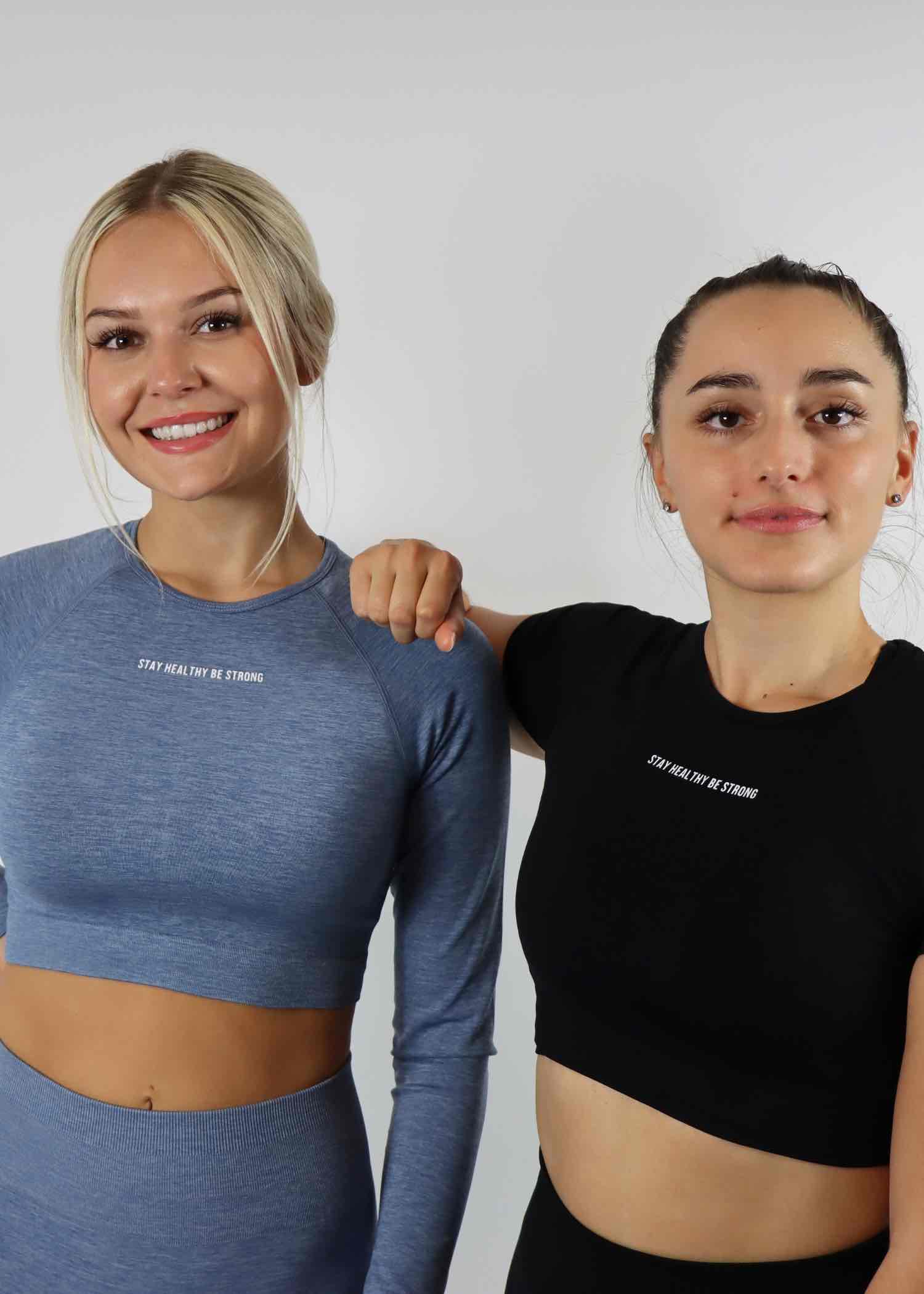 Fade blue amplify long sleeve crop top and black amplify shorts sleeve crop top
