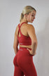 Red high waisted scrunch leggings with red cross back sports bra