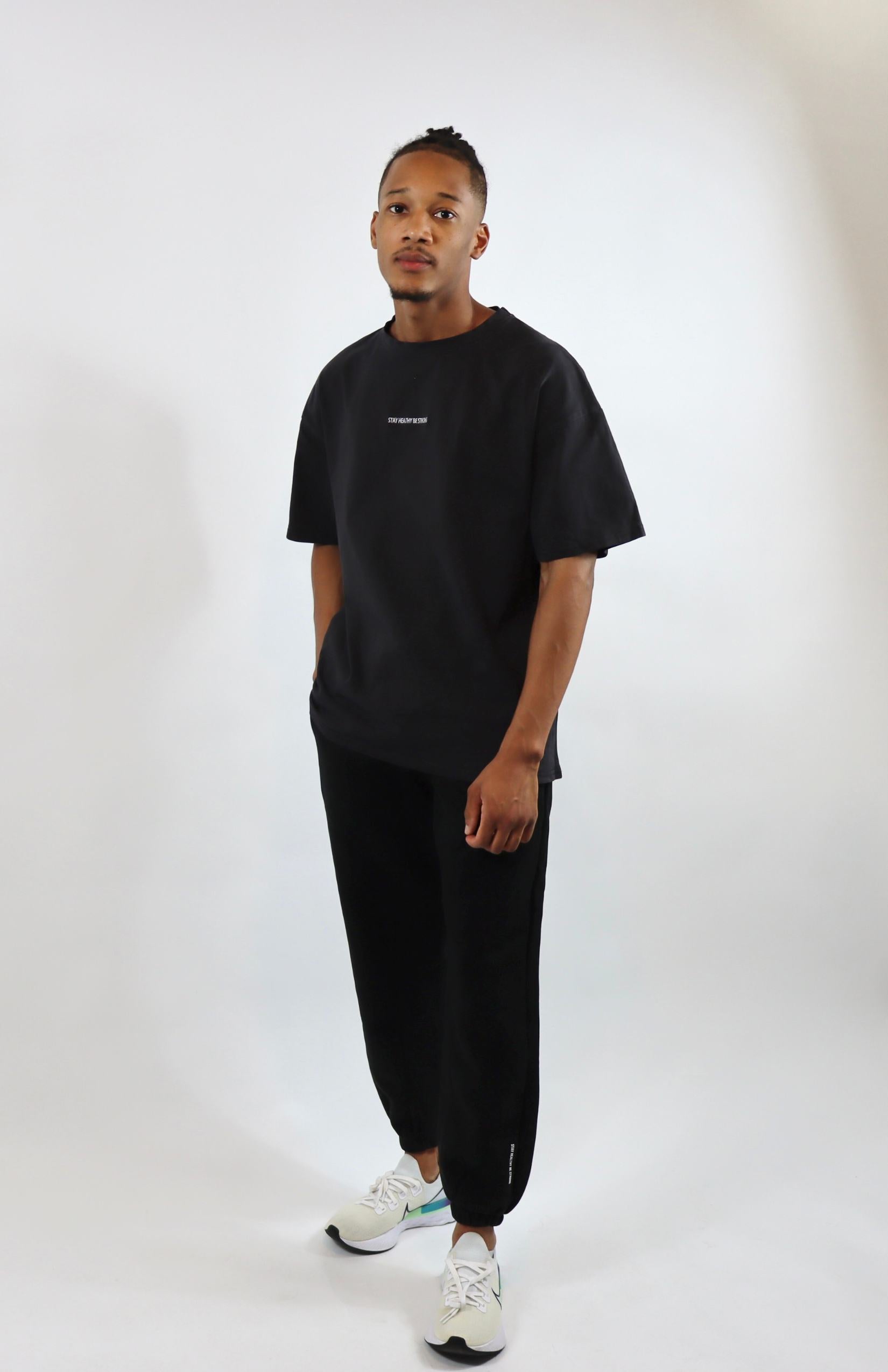 Faded black oversized T-shirt with black oversized sweatpants