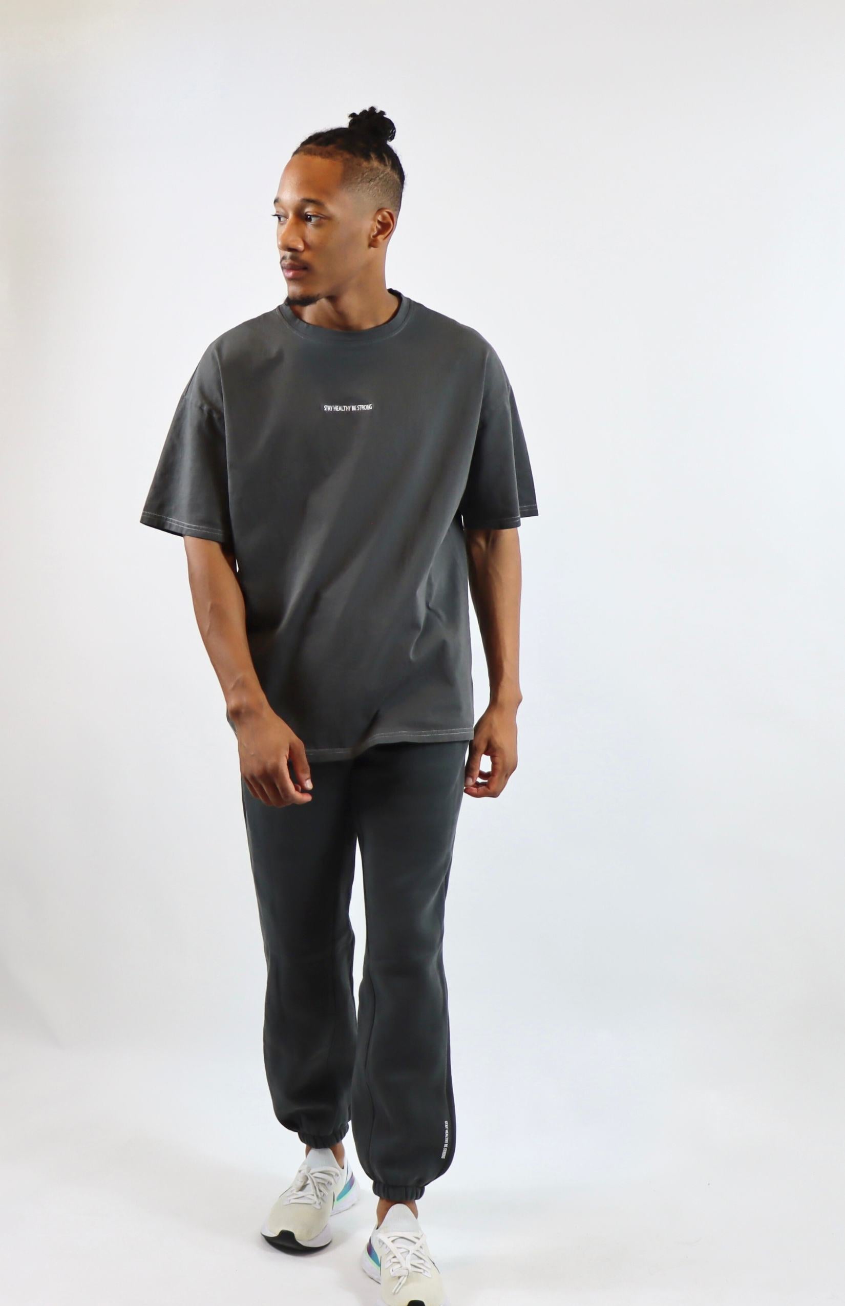 Dark gray oversized sweatpants with faded gray oversized T-shirt