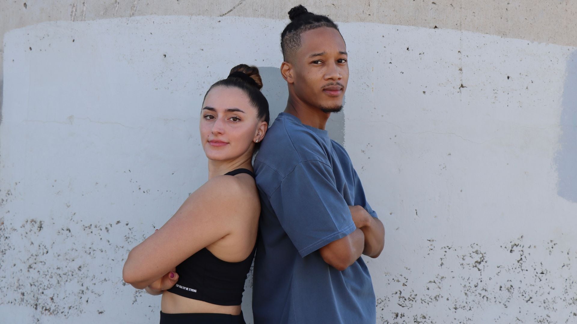 men and women posing together 