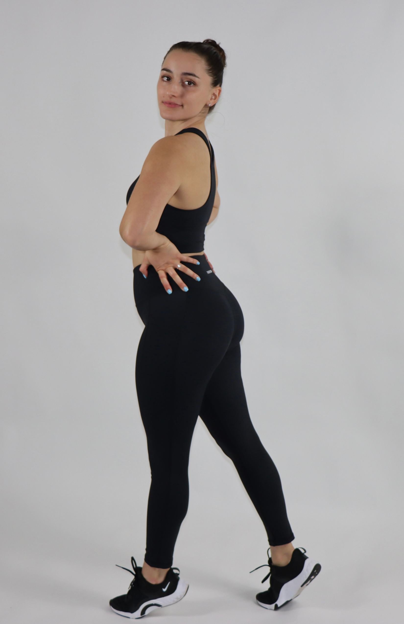 Black high waist pocket leggings with black high-neck sports bra