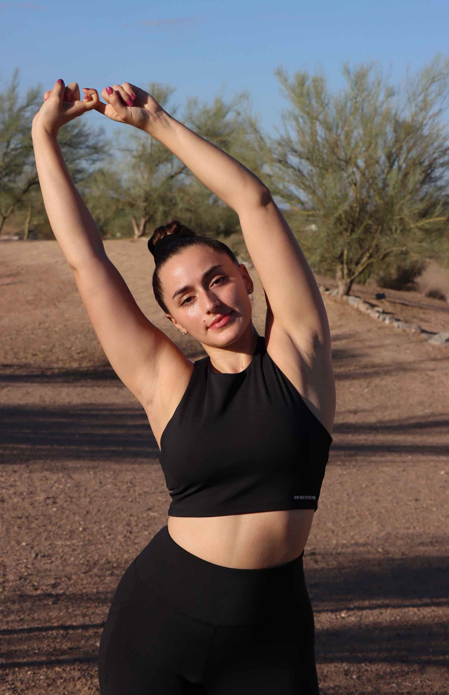 black high-neck sports bra with black leggings 